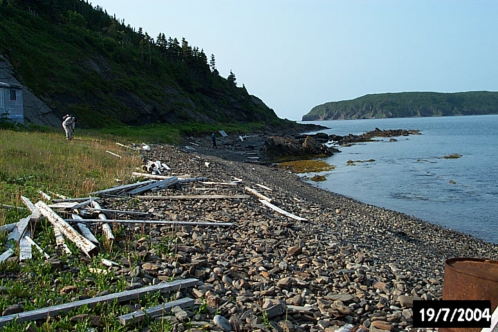 The rocky beach looking out towards the entrance of the bay.
